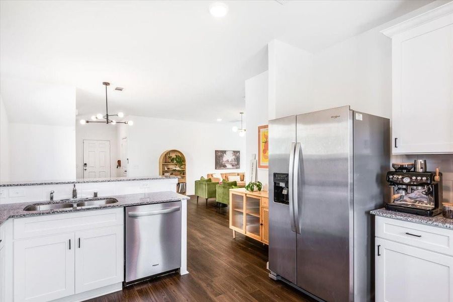 Kitchen features granite countertops , beautiful white cabinets with updates hardware, stainless appliances, large sink and natural light. Kitchen features granite countertops , beautiful white cabinets with updates hardware, stainless appliances, large sink and natural light.