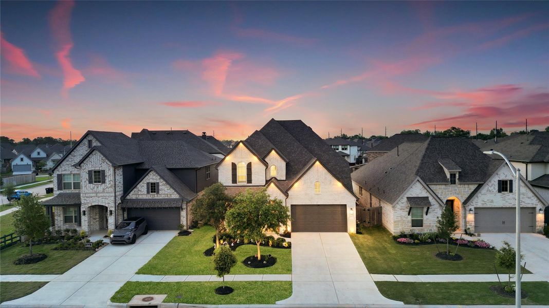 This gorgeous home offers a lush lawn, brick elevation and a spacious driveway.