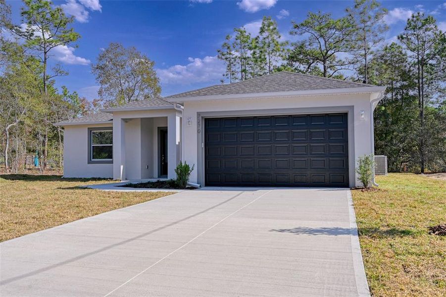 Front exterior of a new home in , Citrus Springs, FL, highlighting curb appeal (Image 20).