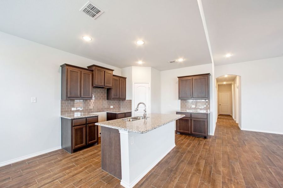 Representative exterior photo of a completed home built from the Wesley by Impression Homes in Heartland, Heartland, TX (Image 4). Representative exterior photo of a completed home built from the Wesley by Impression Homes in Heartland, Heartland, TX (Image 4).