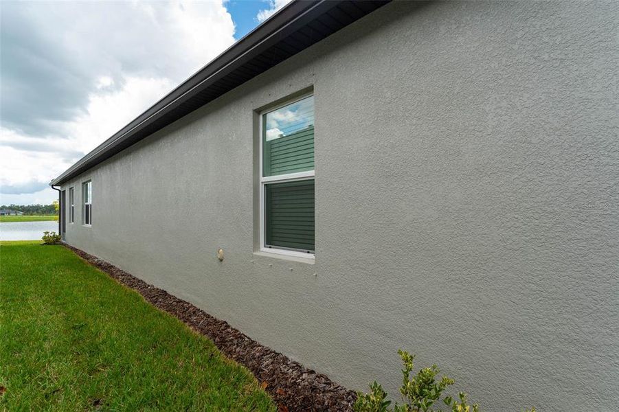 Exterior details and patio area of a home in Prosperity Lakes Active Adult, Parrish (Image 28).