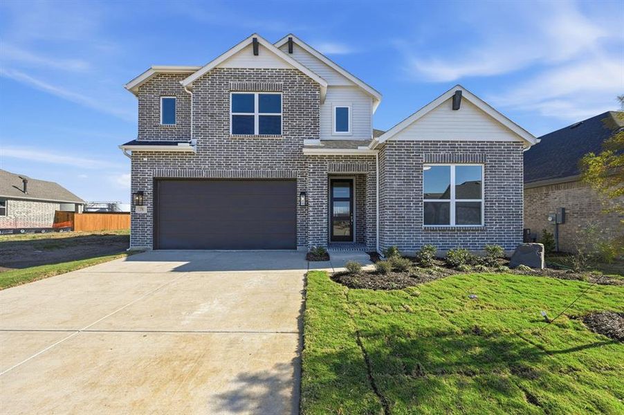 Front exterior of a new home in Heritage Ranch: 50ft. lots, Sherman, TX, highlighting curb appeal (Image 1). Front exterior of a new home in Heritage Ranch: 50ft. lots, Sherman, TX, highlighting curb appeal (Image 1).