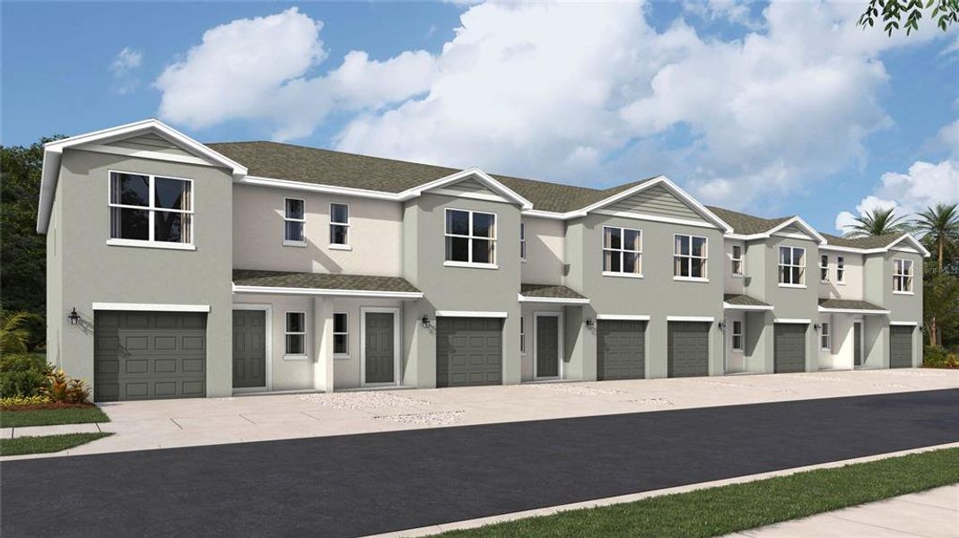 Front exterior of a new home in Townes at Island Lake, Pinellas Park, FL, highlighting curb appeal (Image 2).