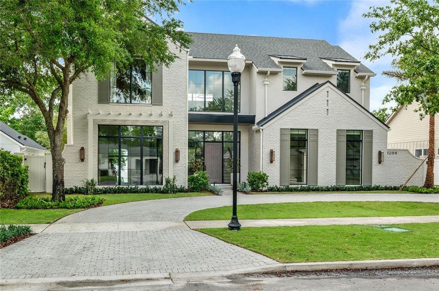 Front exterior of a new home in , Orlando, FL, highlighting curb appeal (Image 23).