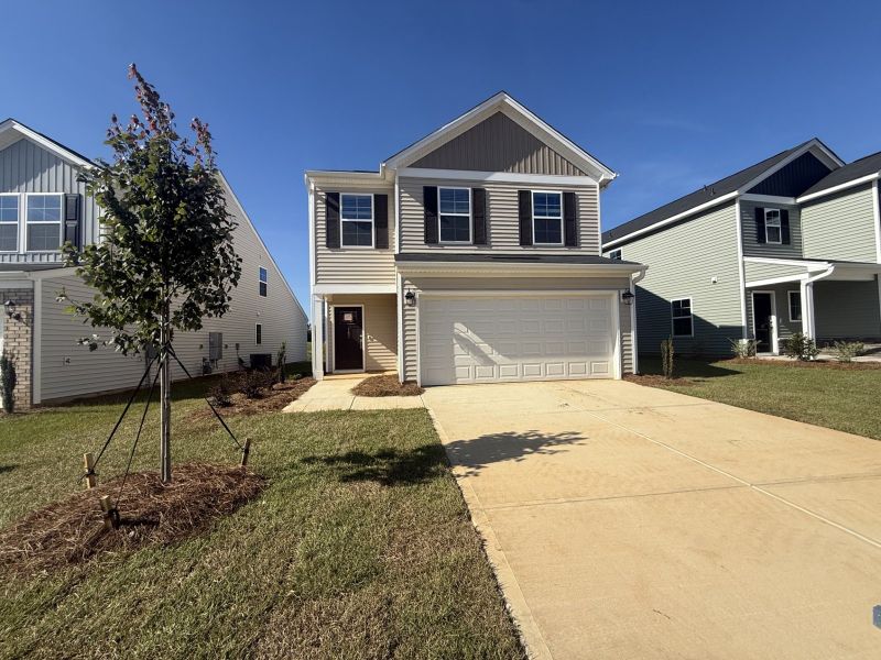 Front exterior of a new home in Laurinton Farms, Hopkins, SC, highlighting curb appeal (Image 1). Front exterior of a new home in Laurinton Farms, Hopkins, SC, highlighting curb appeal (Image 1).