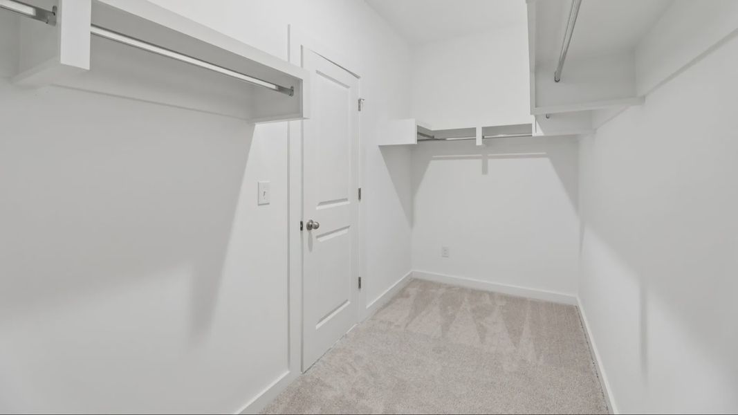 Primary Closet with built-in shelves