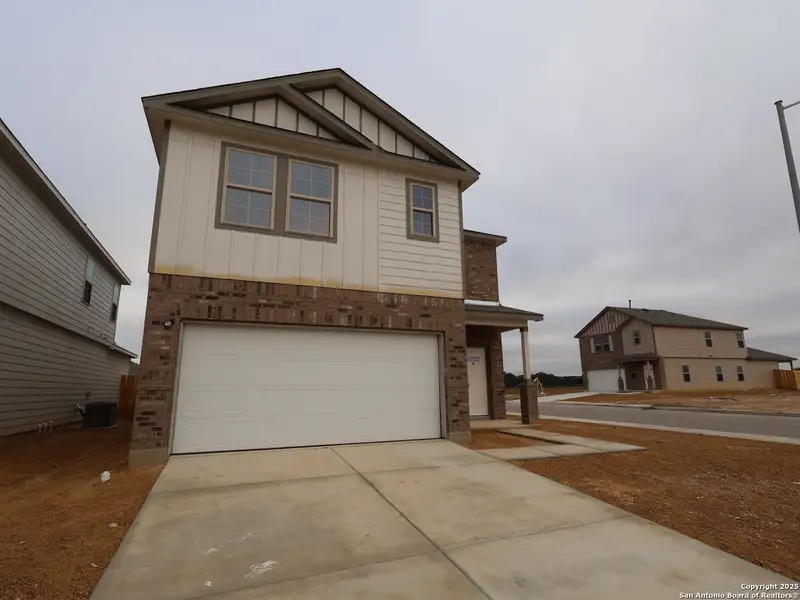 Front exterior of a new home in Winding Brook, San Antonio, TX, highlighting curb appeal (Image 2). Front exterior of a new home in Winding Brook, San Antonio, TX, highlighting curb appeal (Image 2).