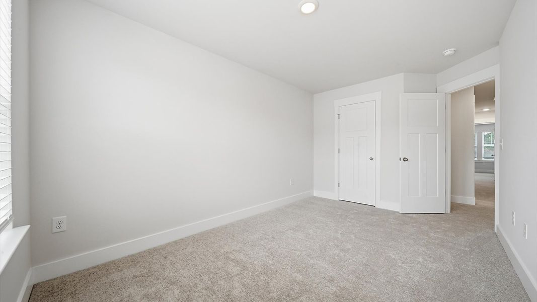 Highly functional bedroom with walk-in closet and tasteful carpet for a restful retreat at Saluda Crossing Highly functional bedroom with walk-in closet and tasteful carpet for a restful retreat at Saluda Crossing