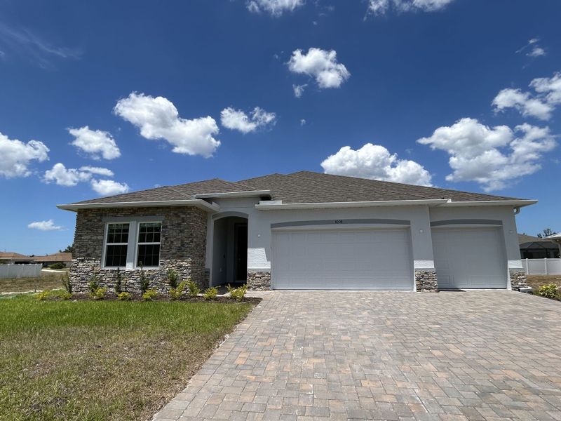Front exterior of a new home in Burnt Store, Cape Coral, FL, highlighting curb appeal (Image 1). Front exterior of a new home in Burnt Store, Cape Coral, FL, highlighting curb appeal (Image 1).