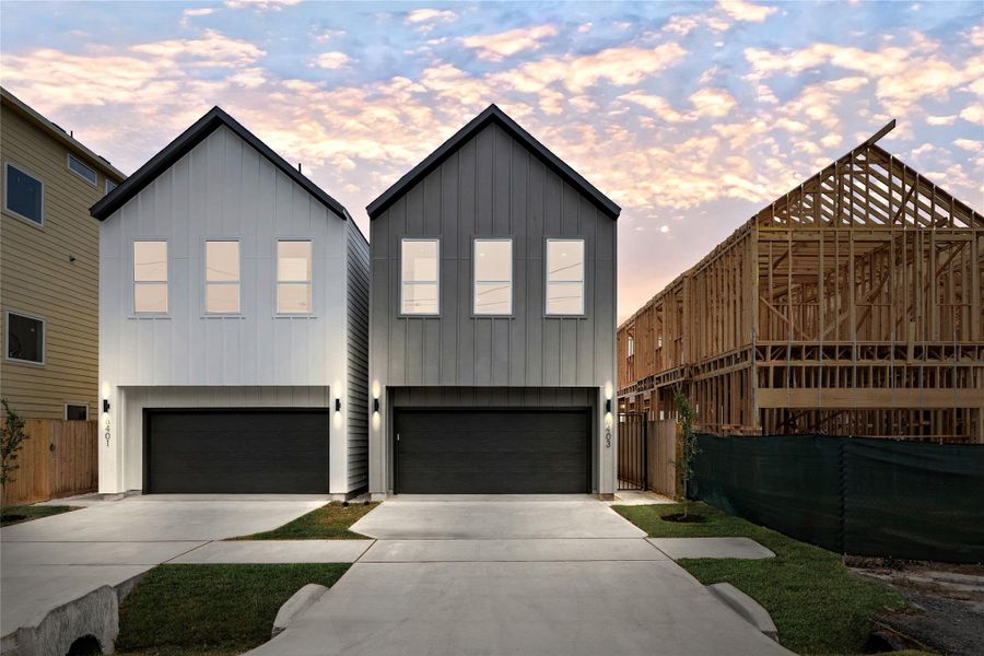 Twin gables rise with symmetryand strength — a striking pair ofNima Homes builds that elevatethe neighborhood aesthetic.