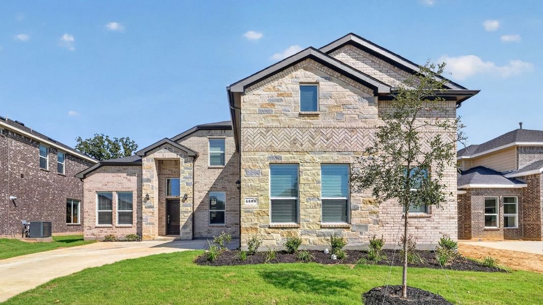Representative exterior photo of a completed home built from the Valley Spring by D.R. Horton in Lakeview Pointe, Midlothian, TX (Image 2).