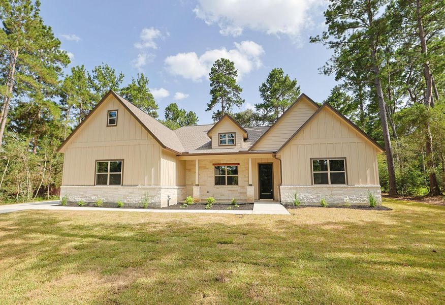Front exterior of a new home in , Magnolia, TX, highlighting curb appeal (Image 22).