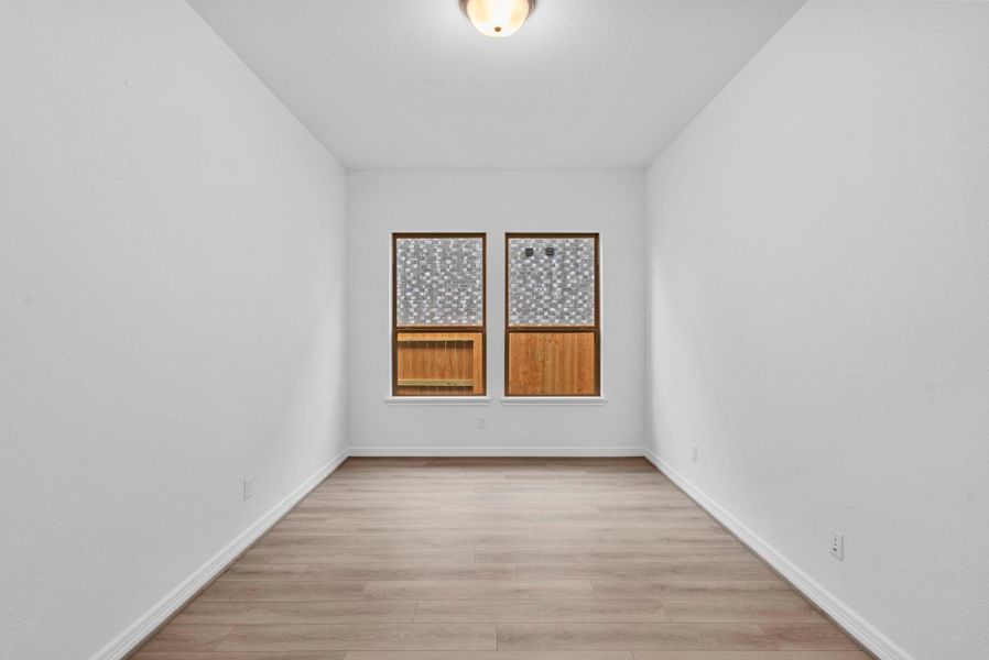 Private study with French doors, beautiful flooring, and large windows—perfect for work, creativity, and peace.