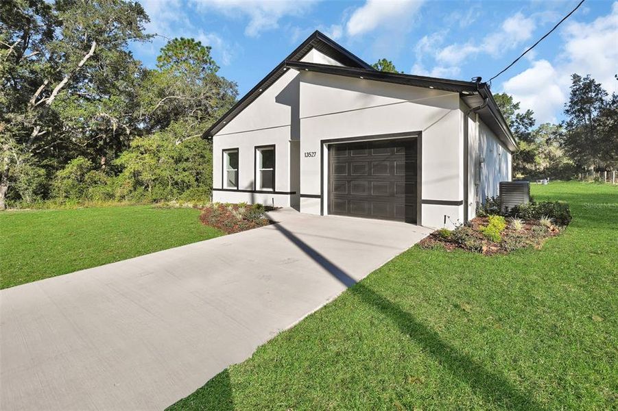 Front exterior of a new home in , Dunnellon, FL, highlighting curb appeal (Image 29).