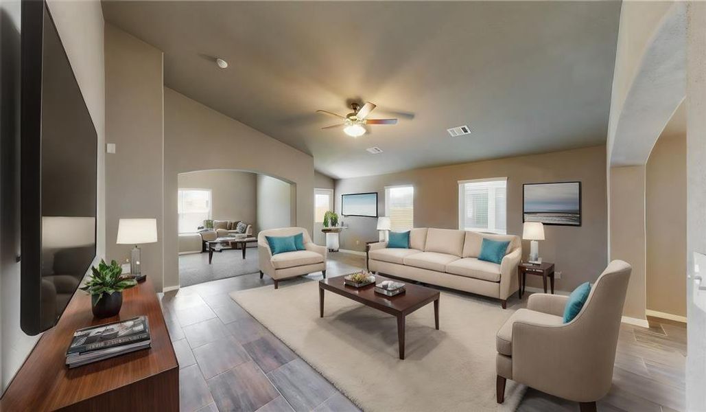 The living room offers a warm andinviting atmosphere with its largewindows, contemporary tileflooring, and ample space forversatile furniture arrangements.The open concept design ensuresan easy flow between the livingarea and the adjoining spaces,creating an ideal setting forgatherings. This is a picture of anElise Floor Plan with anotherSaratoga Homes.