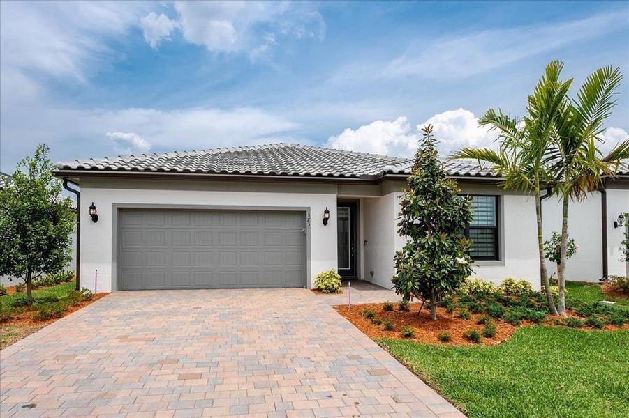 Front exterior of a new home in , Port St. Lucie, FL, highlighting curb appeal (Image 19). Front exterior of a new home in , Port St. Lucie, FL, highlighting curb appeal (Image 19).