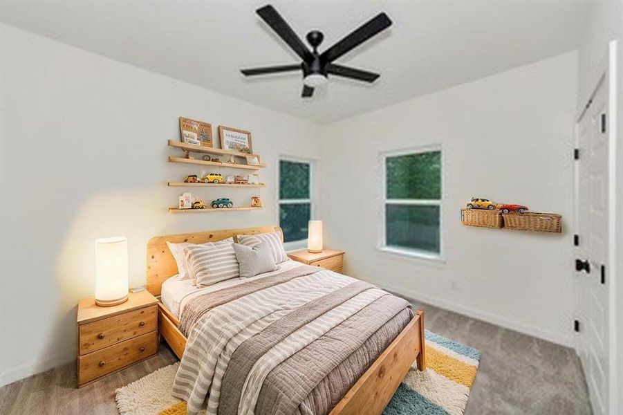 Bedroom featuring baseboards and ceiling fan Bedroom featuring baseboards and ceiling fan