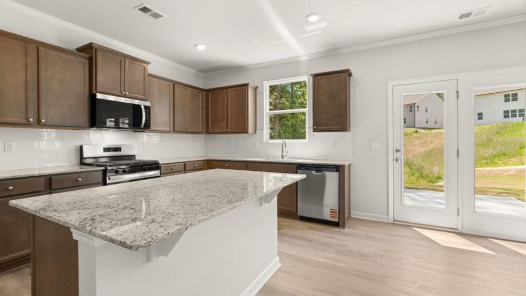 Furnished interior view inside a new home in Northwoods at Mirror Lake, Villa Rica (Image 9).