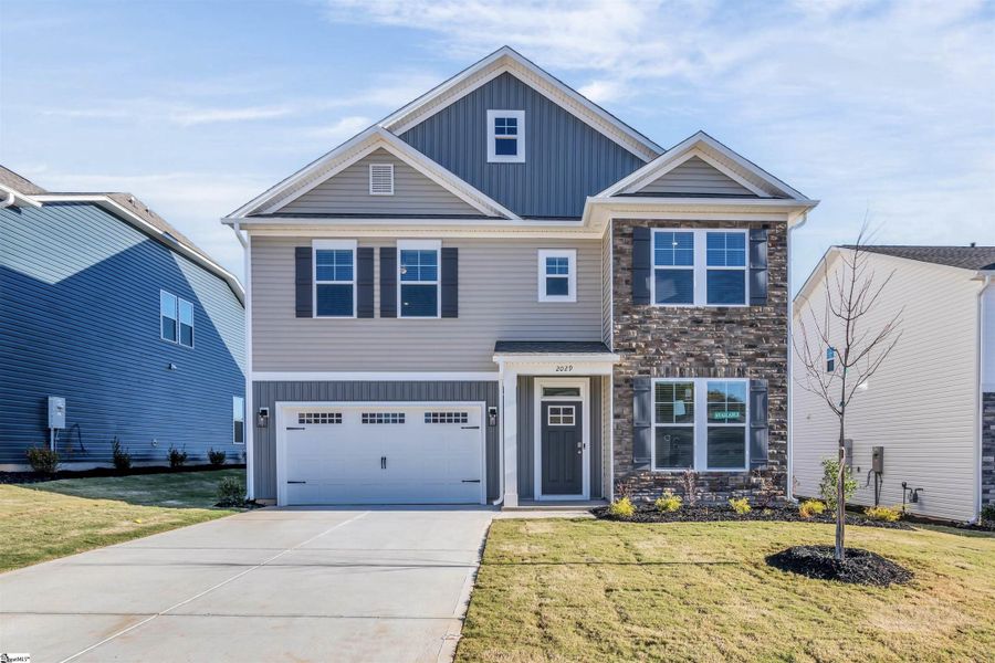 Front exterior of a new home in Halton Oaks, Spartanburg, SC, highlighting curb appeal (Image 2).