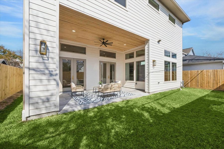 The fully fenced, low-maintenance yard provides a wonderful space for loved ones to run, play, and enjoy the outdoors.