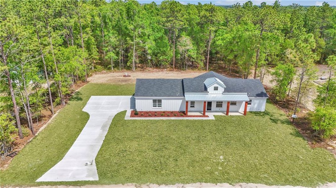 Front exterior of a new home in , Ocala, FL, highlighting curb appeal (Image 25).