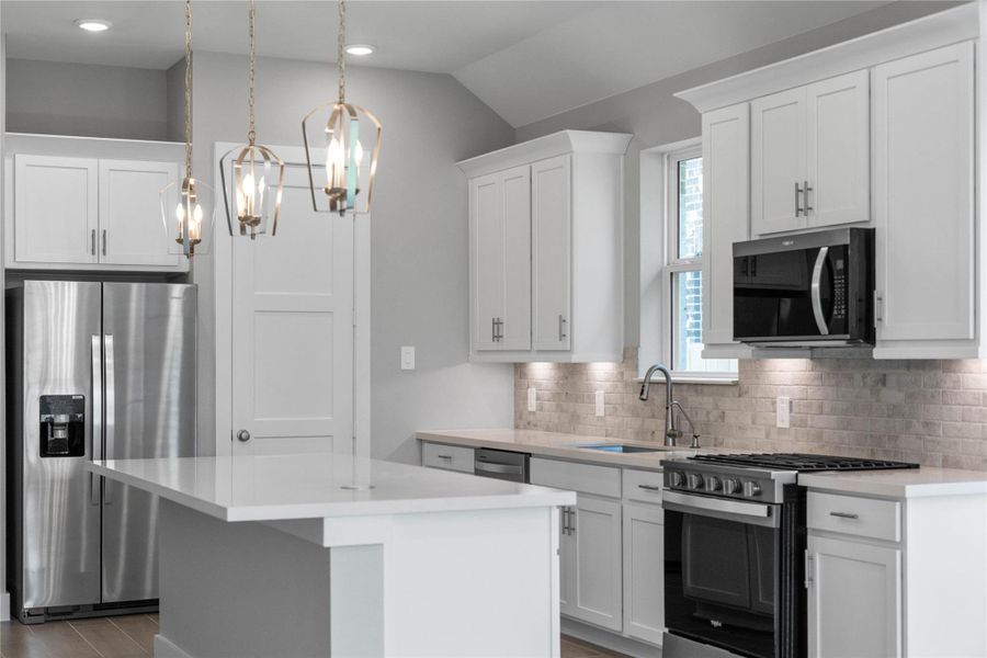 This modern kitchen comes equipped with stainless steel appliances.