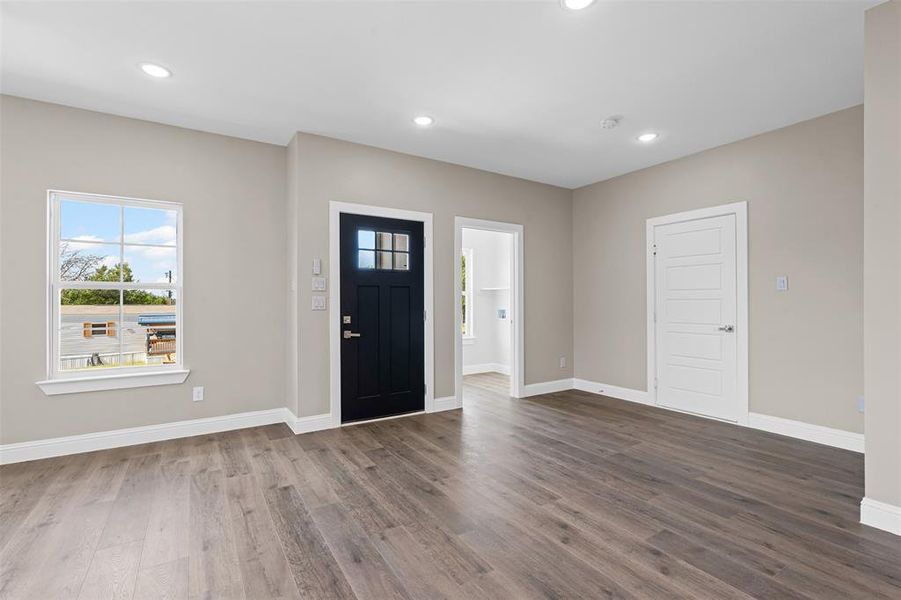 Entrance foyer featuring plenty of natural light, recessed lighting, and wood finished floors Entrance foyer featuring plenty of natural light, recessed lighting, and wood finished floors