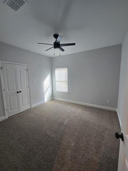 Unfurnished room with carpet flooring and baseboards