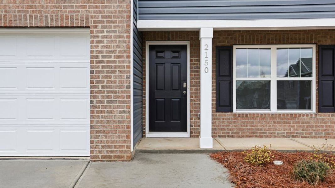 Exterior details and patio area of a home in Treemont Commons, Wellford (Image 3).