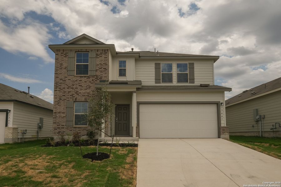 Front exterior of a new home in Hunters Ranch, San Antonio, TX, highlighting curb appeal (Image 22).