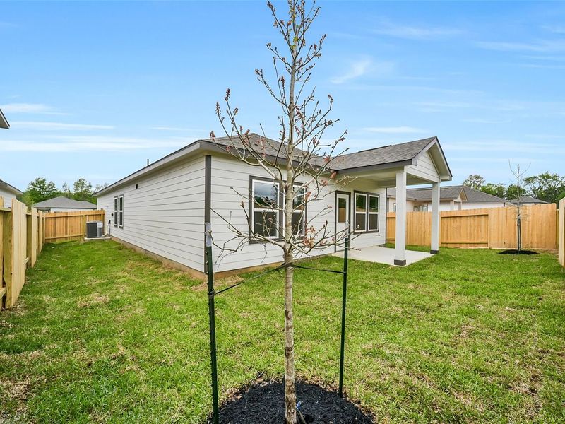 Exterior details and patio area of a home in Caney Creek Place, Conroe (Image 24).