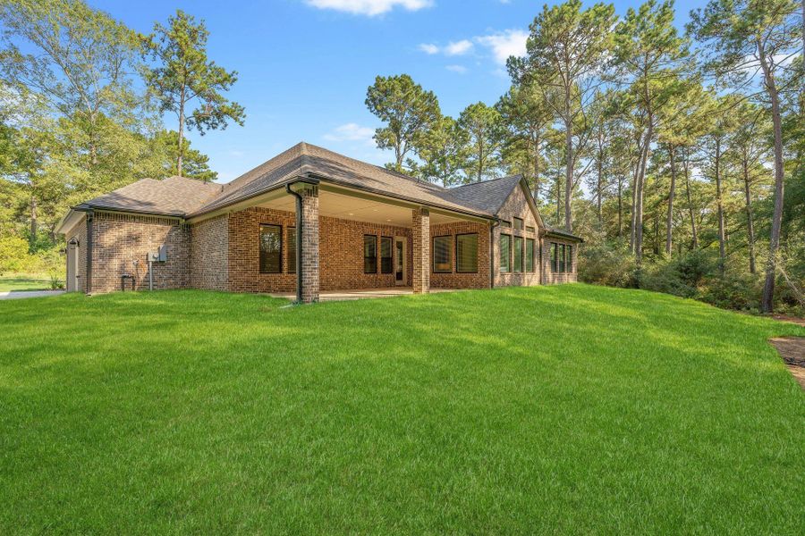 Exterior details and patio area of a home in The Cedars, Plantersville (Image 3).