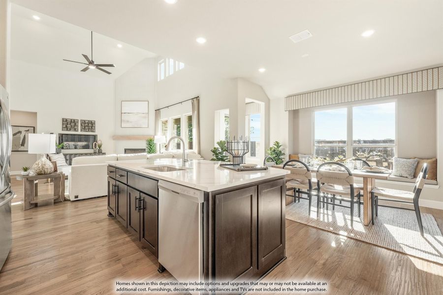 Open-concept kitchen with dark island, quartz countertop, and hardwood floors flowing into dining and living areas with vaulted ceiling Open-concept kitchen with dark island, quartz countertop, and hardwood floors flowing into dining and living areas with vaulted ceiling