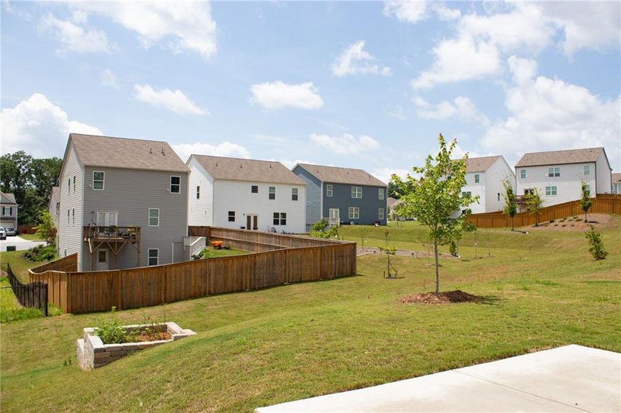 Front exterior of a new home in Braselton Village, Braselton, GA, highlighting curb appeal (Image 2). Front exterior of a new home in Braselton Village, Braselton, GA, highlighting curb appeal (Image 2).