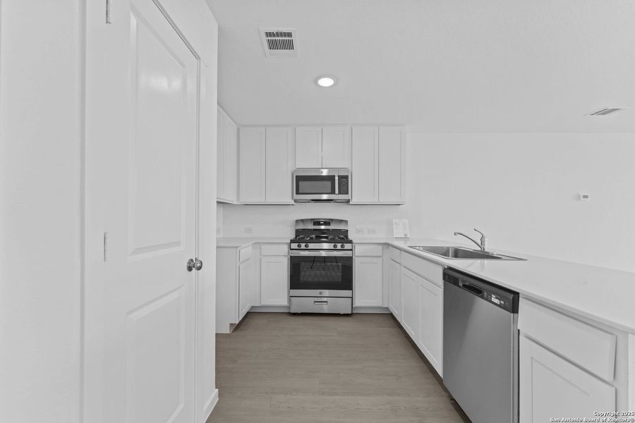 Furnished interior view inside a new home in , New Braunfels (Image 7).
