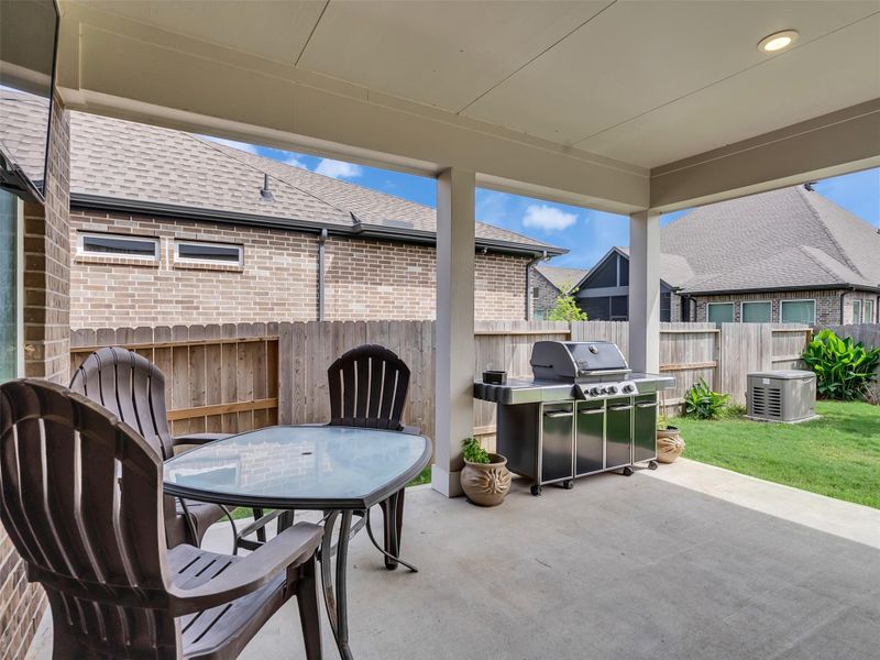 Exterior details and patio area of a home in ARTAVIA, Conroe (Image 3).