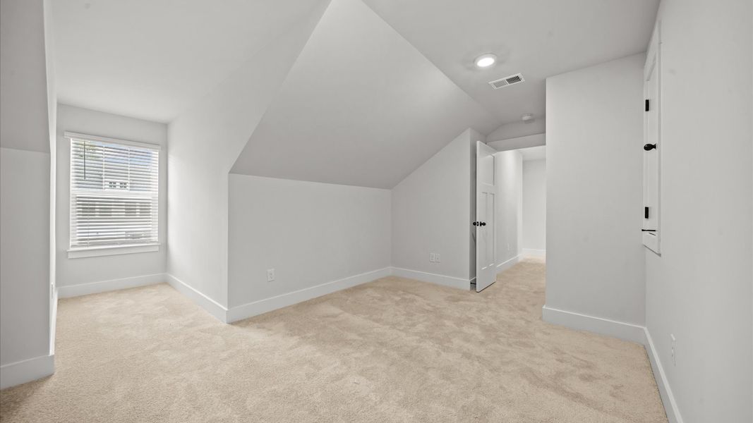 Inviting loft with cozy carpet, perfect for casual gatherings or quiet relaxation