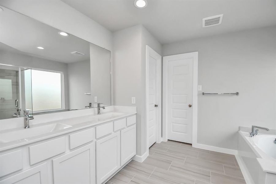 Take another look at the spacious primary bathroom!