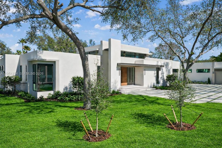 Front exterior of a new home in , Palmetto Bay, FL, highlighting curb appeal (Image 21).