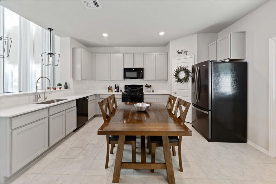 The open flow to the family room keeps everyone connected during busy mornings or relaxed weekends. The open flow to the family room keeps everyone connected during busy mornings or relaxed weekends.