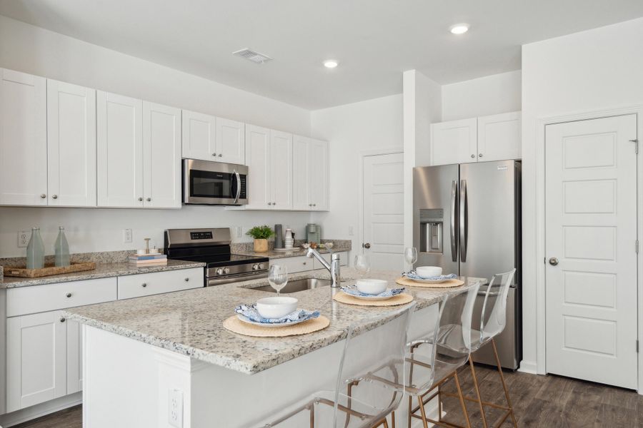 Furnished interior view inside a new home in Lindera Preserve at Cane Bay Plantation: Townhomes, Summerville (Image 21).