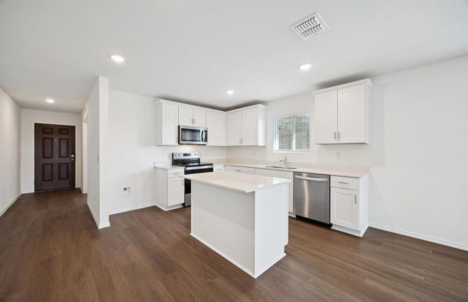 Spacious kitchen with eat-in bartop island Spacious kitchen with eat-in bartop island