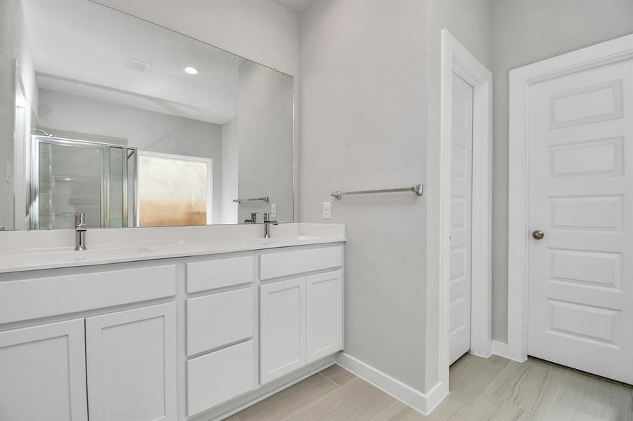 Indulge in a spa-like retreat within the confines of this primary bathroom.