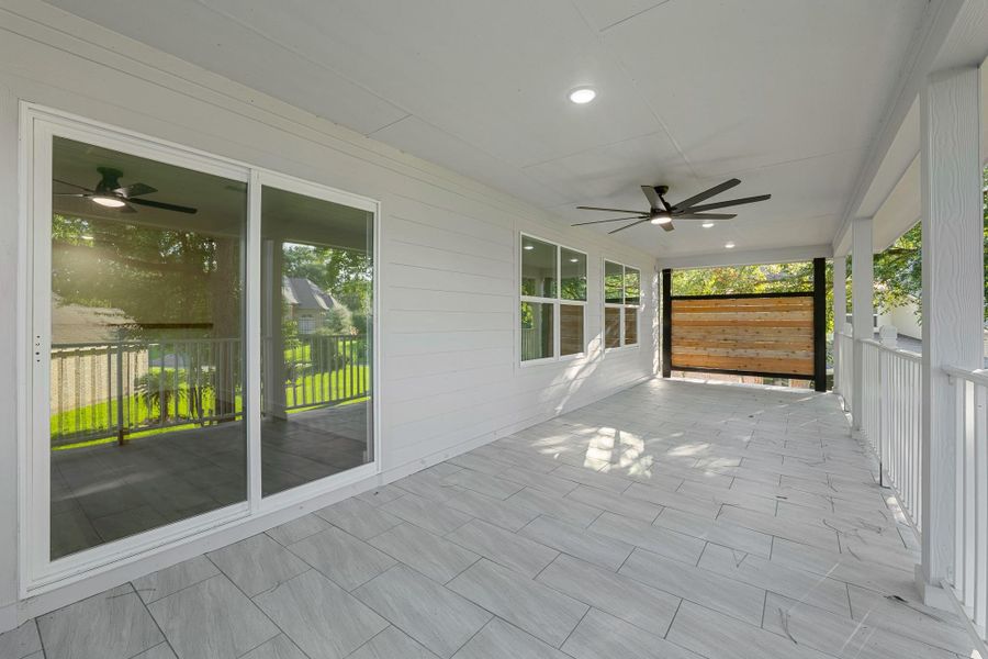 Spacious second-story porch with elegant tile flooring, perfect for relaxing and enjoying the view. Spacious second-story porch with elegant tile flooring, perfect for relaxing and enjoying the view.