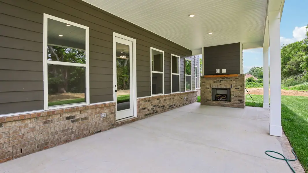Covered back patio with fireplace Covered back patio with fireplace