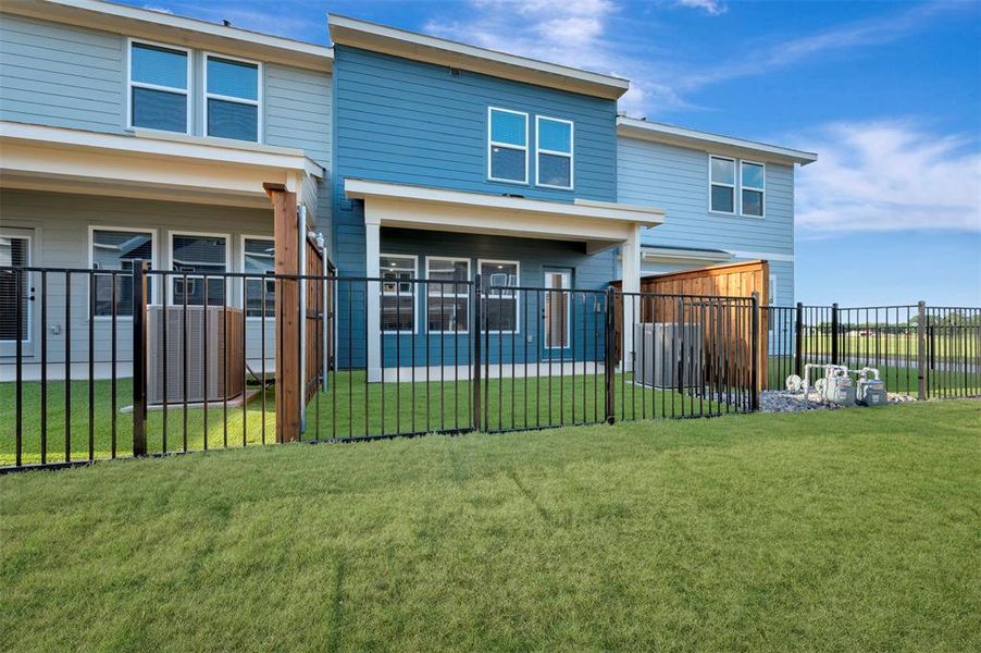 Exterior details and patio area of a home in Providence Commons, Providence Village (Image 19).