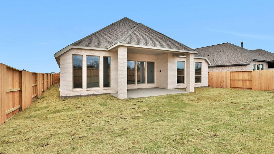 Exterior details and patio area of a home in Meridiana, Manvel (Image 4). Exterior details and patio area of a home in Meridiana, Manvel (Image 4).