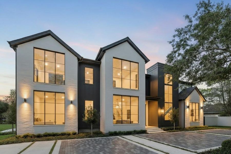 Architectural design blends transitional style with slurry brick, Venetian plaster walls, RAM custom glass windows, and an oversized custom glass entry door Architectural design blends transitional style with slurry brick, Venetian plaster walls, RAM custom glass windows, and an oversized custom glass entry door