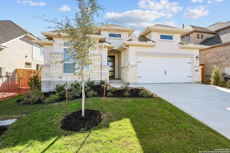 Front exterior of a new home in Mayfair 50', New Braunfels, TX, highlighting curb appeal (Image 19).