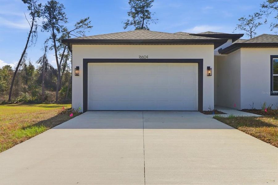 Front exterior of a new home in , Ocala, FL, highlighting curb appeal (Image 24).